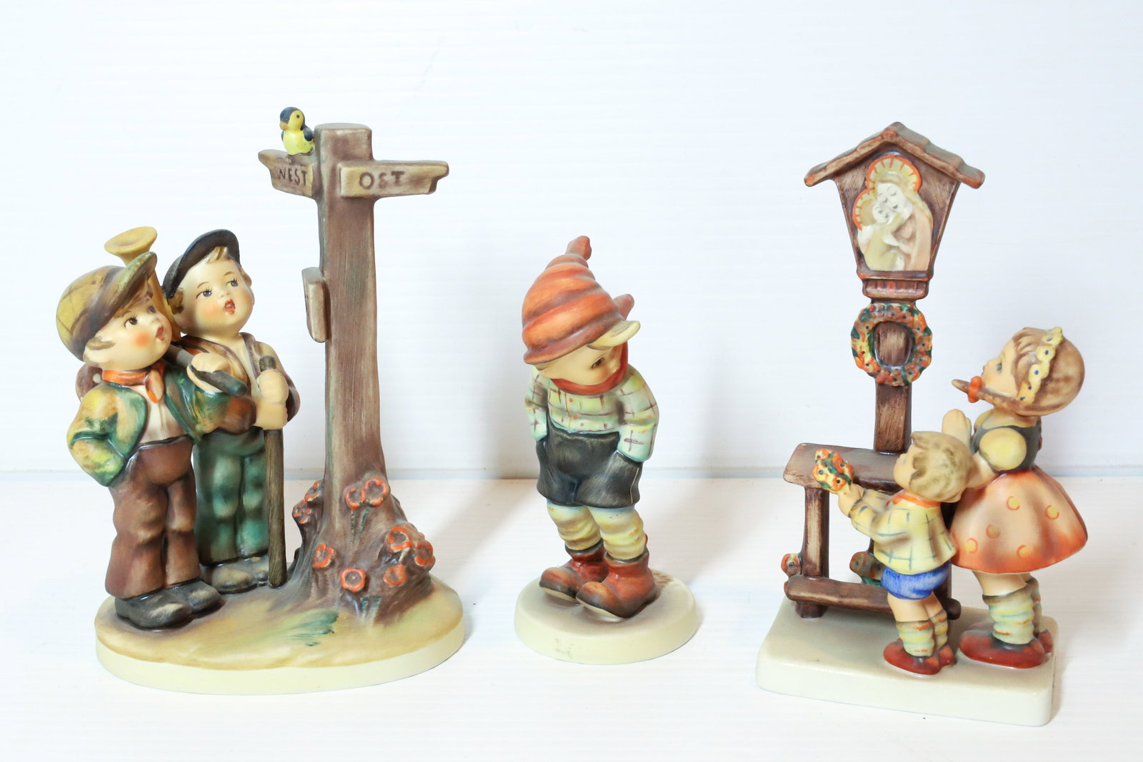 HUMMEL FIGURINES: ADORATION 6 1/4", CROSSROADS AND MARCH WINDS. TMK-5 MARK PLEASE READ CAREFULLY - Terms for Purchasing and Shipping of Auction Items. Please read carefully before bidding. All payments for purchases wi