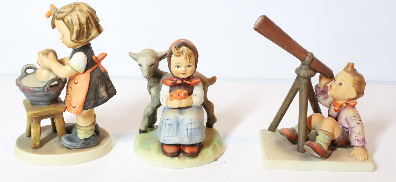 HUMMEL FIGURINES: GOODS FRIENDS 4" H, STARGAZER AND DOLL BATH. TMK-5 MARKS PLEASE READ CAREFULLY - Terms for Purchasing and Shipping of Auction Items. Please read carefully before bidding. All payments for purchases wi