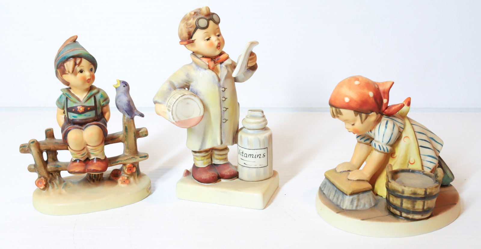 HUMMEL FIGURINES: LITTLE PHARMACIST 6" H, WAYSIDE HARMONY AND BIG HOUSE CLEANING. TMK-5 MARKING PLEASE READ CAREFULLY - Terms for Purchasing and Shipping of Auction Items. Please read carefully before bidding. All paym