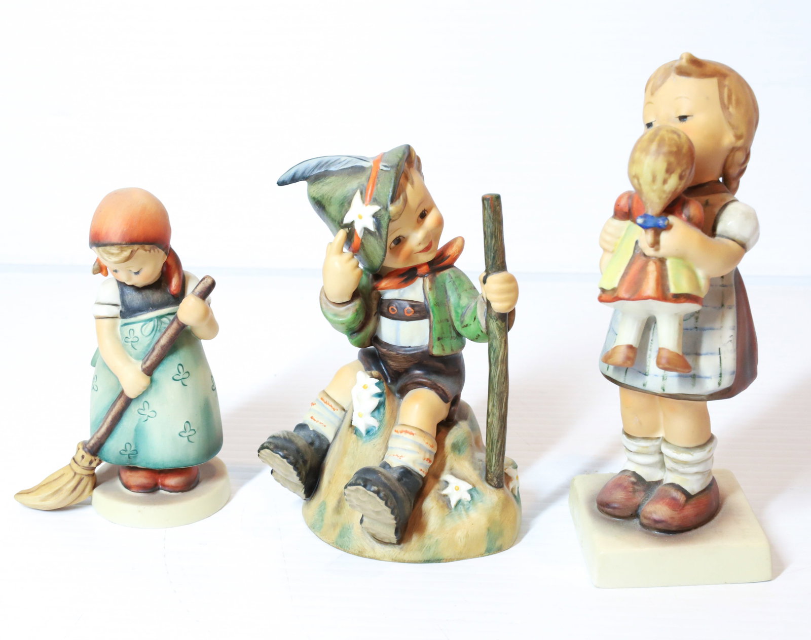 HUMMEL FIGURINES: THE MOUNTAINEER # 315 5", LITTLE SWEEPER AND KISS ME. TMK-5 MARKS PLEASE READ CAREFULLY - Terms for Purchasing and Shipping of Auction Items. Please read carefully before bidding. All payments for pur