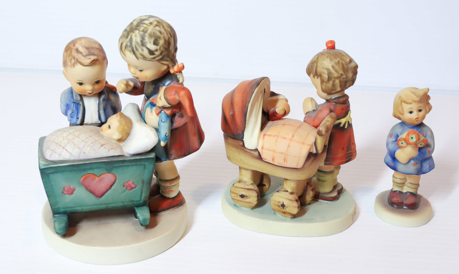 HUMMEL FIGURINES: BLESSED EVENT 5 1/2"H, DOLL MOTHER AND GIRL WITH NOSEGAY. TMK-5 MARKS PLEASE READ CAREFULLY - Terms for Purchasing and Shipping of Auction Items. Please read carefully before bidding. All payments for