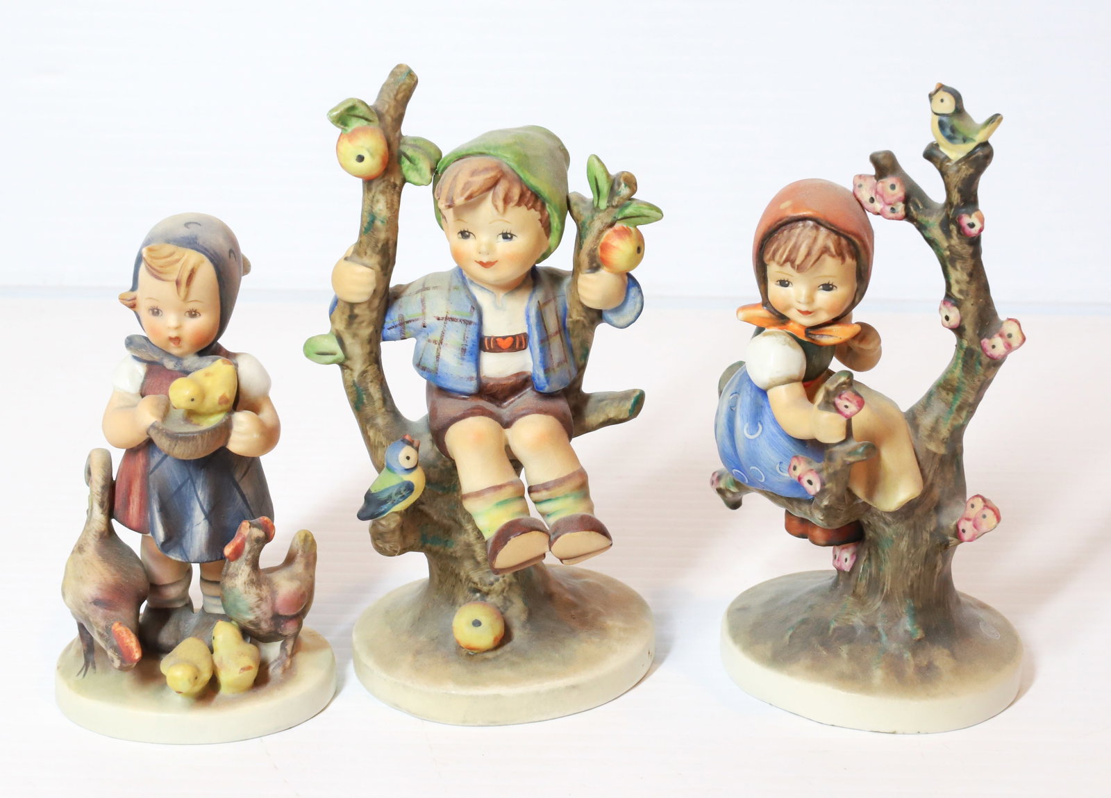 HUMMEL FIGURINES: APPLE TREE BOY, APPLE TREE GIRL 5 1/2"H AND FEEDING TIME. TMK-3 MARKS PLEASE READ CAREFULLY - Terms for Purchasing and Shipping of Auction Items. Please read carefully before bidding. All payments for