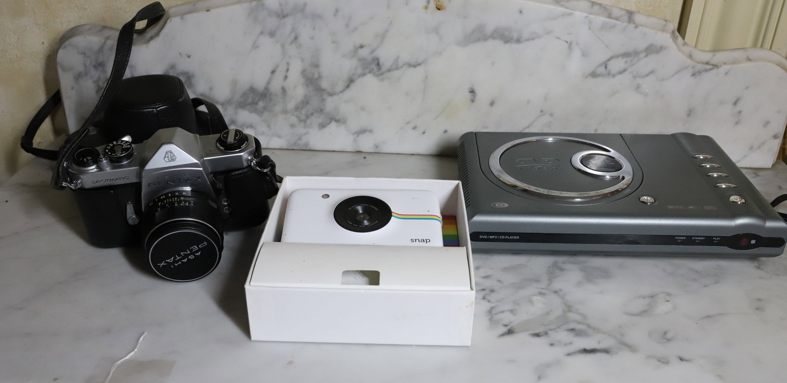 ELECTRONIC LOT: PENTAX ASAHI SPOTMATIC CAMERA, SNAP POLAROID AND MORE PLEASE READ CAREFULLY - Terms for Purchasing and Shipping of Auction Items. Please read carefully before bidding. All payments for purchases will 