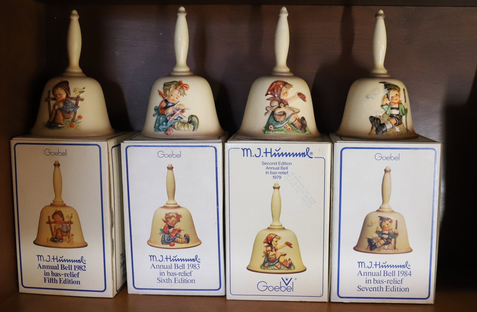 HUMMEL LOT: (4) BELLS PLEASE READ CAREFULLY - Terms for Purchasing and Shipping of Auction Items. Please read carefully before bidding. All payments for purchases will be made through LiveAuctioneers.com payment 