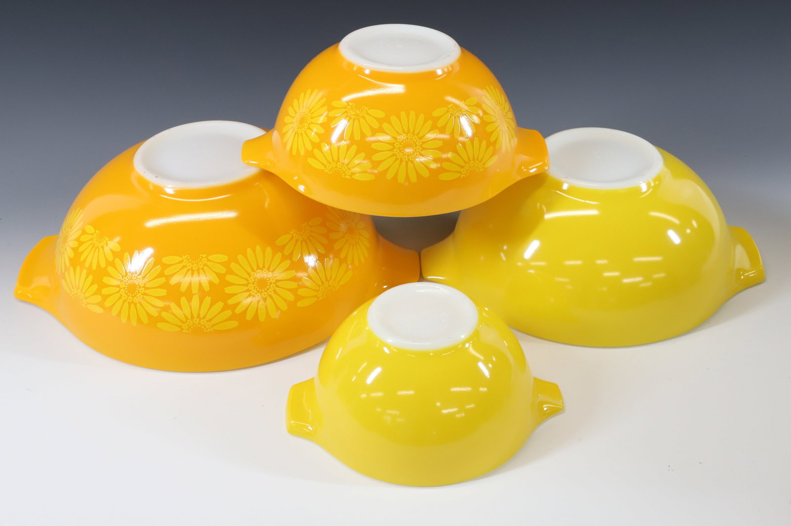 NEST OF PYREX DAISY MIXING BOWLS: TWO ORANGE AND TWO YELLOW CINDERELLA BOWLS. ORIGINAL BOX. PLEASE READ CAREFULLY - Terms for Purchasing and Shipping of Auction Items. Please read carefully before bidding. All payments for purchases w