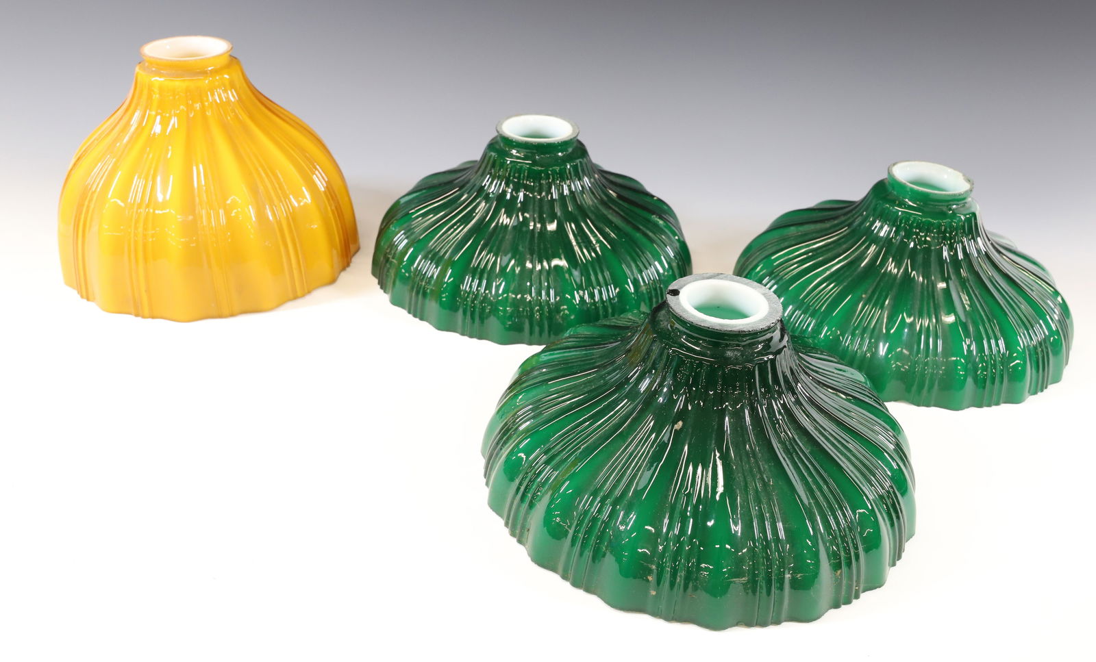 LOT OF (4) CASED SHADES: THREE EMERALD GREEN (4" X 9" WITH 2 1/4" FITTER). ONE CARAMEL (6" X 8" WITH 2 1/4" FITTER) PLEASE READ CAREFULLY - Terms for Purchasing and Shipping of Auction Items. Please read carefully before bidd