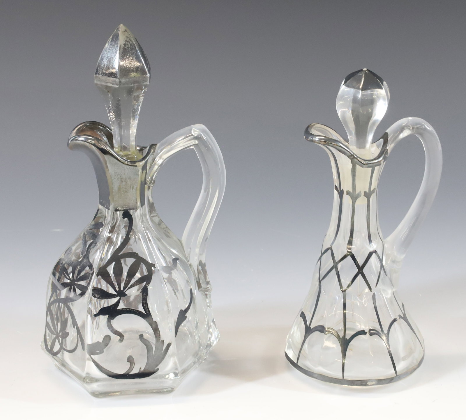 (2) SILVER OVERLAY CRUETS: 6" AND 7" HEIGHTS. PLEASE READ CAREFULLY - Terms for Purchasing and Shipping of Auction Items. Please read carefully before bidding. All payments for purchases will be made through LiveAuctioneers.com