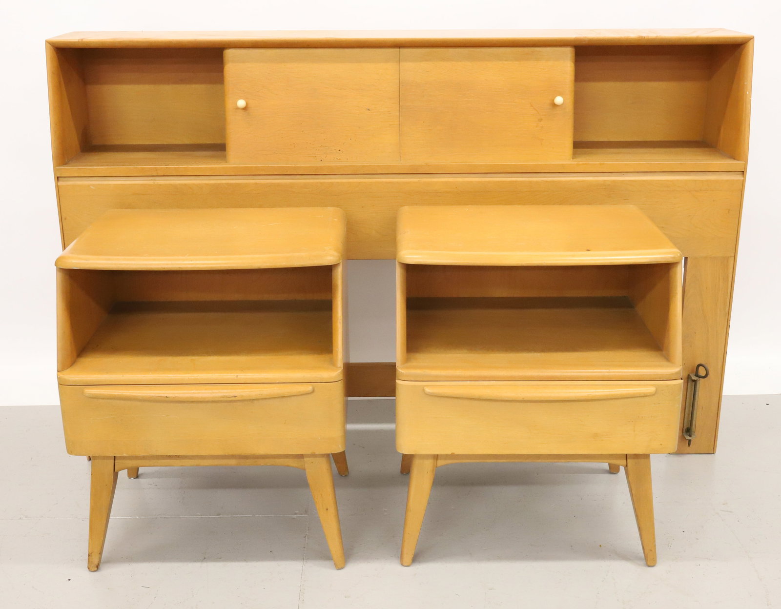 HEYWOOD WAKEFIELD HEADBOARD AND NIGHTSTANDS: HEADBOARD WITH SLIDING DOOR TOP. 37" X 57 1/2" X 10". NIGHTSTANDS HAVE SINGLE DRAWER. 24" X 20" X 15". PLEASE READ CAREFULLY - Terms for Purchasing and Shipping of Auction Items. Please read carefully