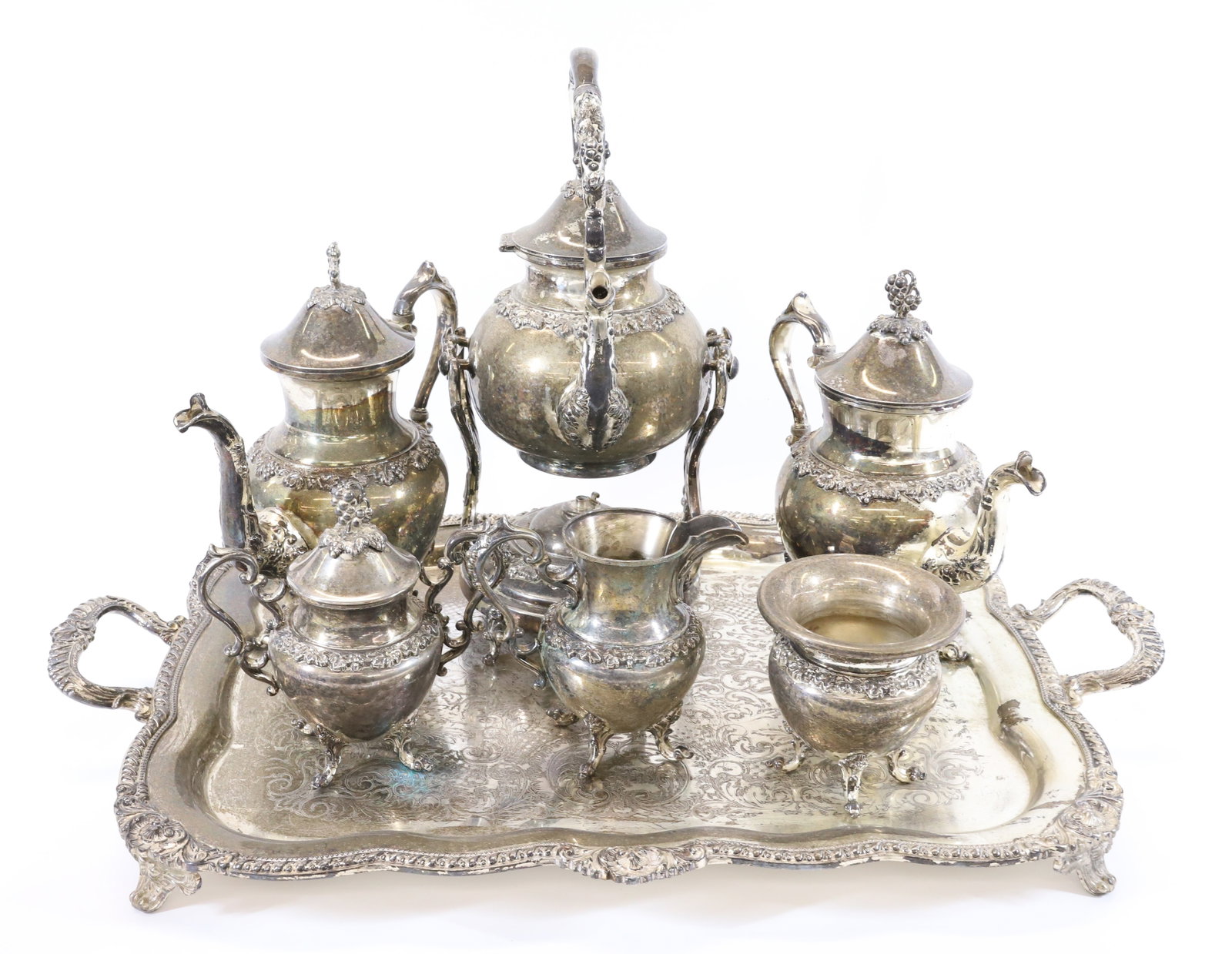 ENGLISH SHEFFIELD TEA/COFFEE SERVICE: SHEFFIELD HALLMARKS, INCLUDES, HOT WATER POT AND STAND, COFFEE,TEA POTS, COVERED SUGAR BOWL, CREAMER, WASTE BOWL AND LARGE FOOTED,HANDLED TRAY 19TH CENTURY 16 1/2" X 9" HOT WATER POT, TRAY 29" X 19" P