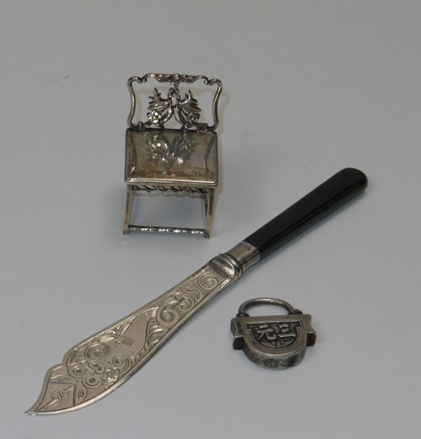 Chinese Silver Grouping: Fish knife Nephrite handle Engraved dragon blade marked sterling 7 1/8"; Silver chair 2 1/2" x 1 1/2" x 1 1/4" chop marks; Silver lock with no key. Overall condition Good