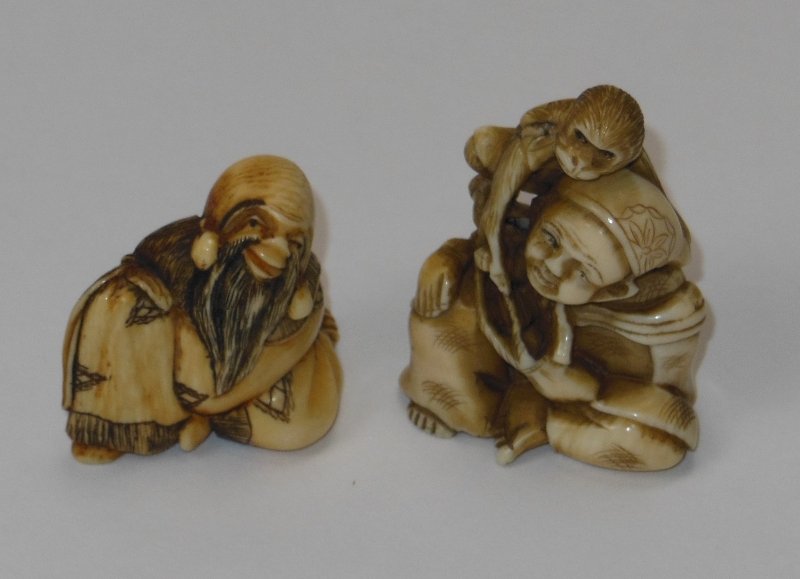 (2) Ivory Netsuke: 1 5/8" x 1 1/4" man & monkey; Chinese Elder 1 1/8" x 1/8". Good