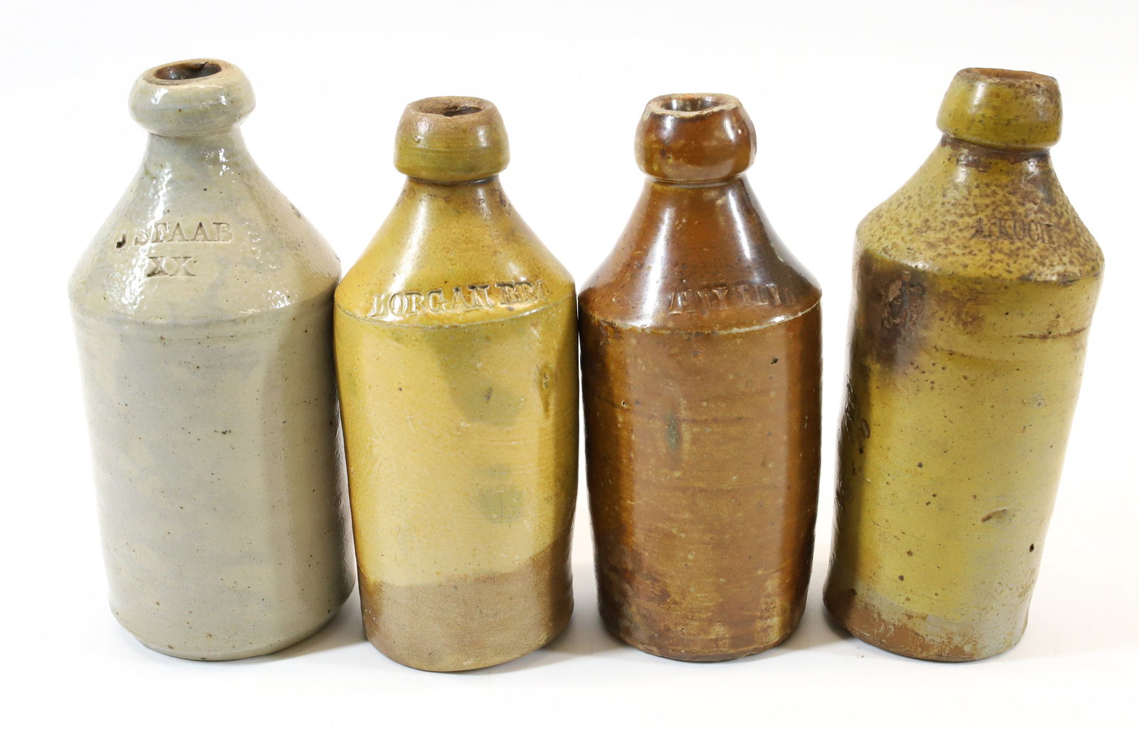 (4) STONEWARE BOTTLES (1 of 8)