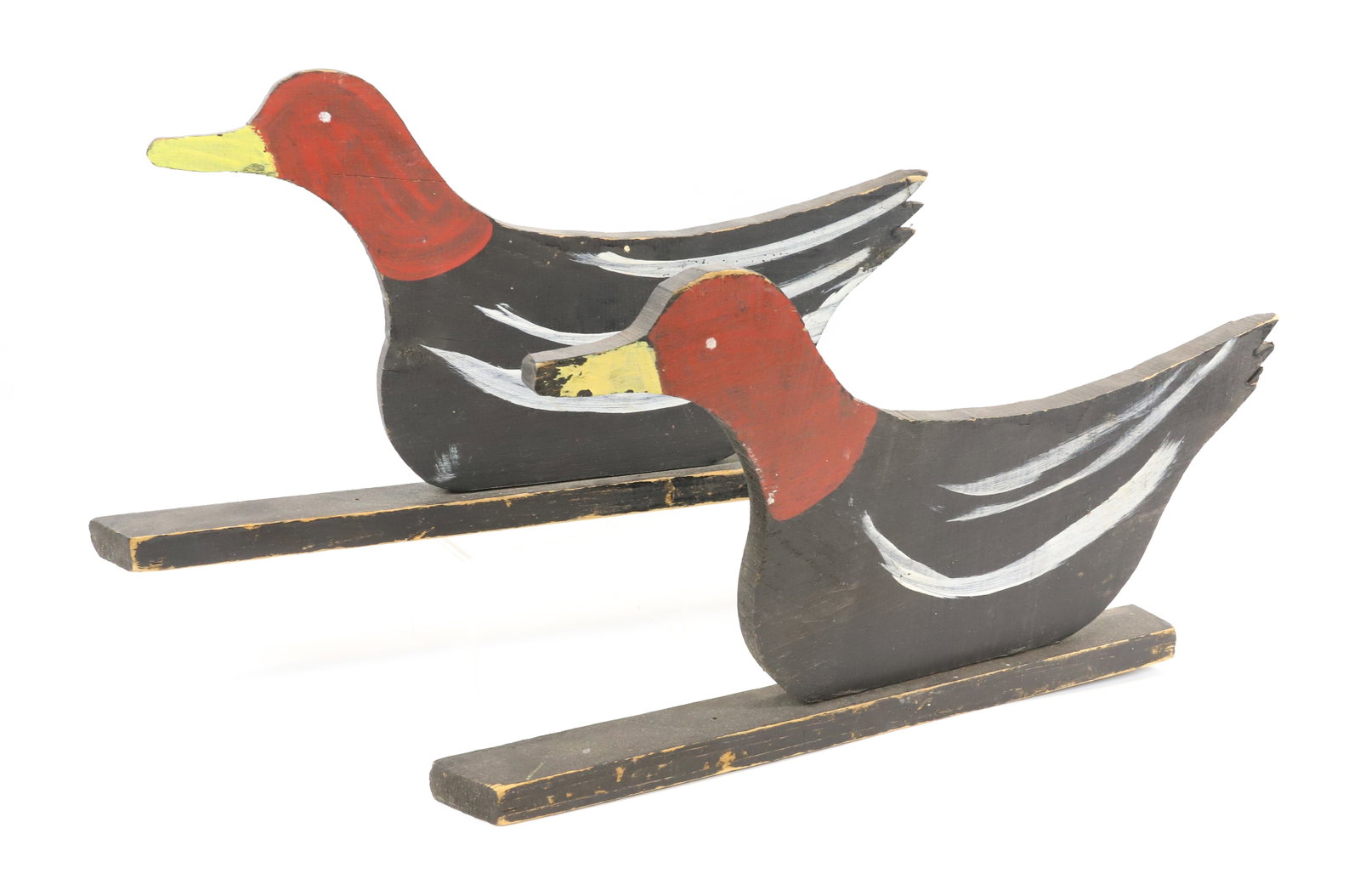 PAIR OF PAINTED WOODEN DUCKS: BLACK/RED/WHITE/YELLOW PAINT. BIRDS ARE 19" L. PLEASE READ CAREFULLY - Terms for Purchasing and Shipping of Auction Items. Please read carefully before bidding. All payments for purchases will be made