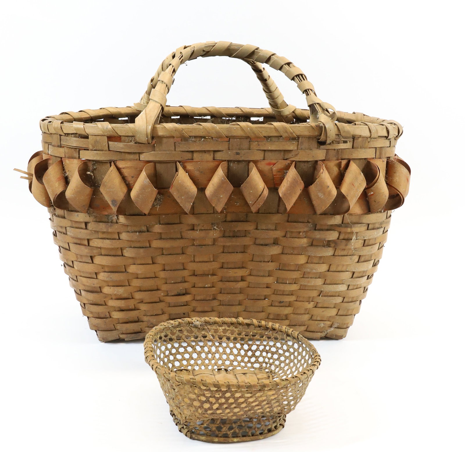 NATIVE AMERICAN TOURIST BASKET: DOUBLE HANDLES WITH RIBBON DECORATION AROUND TOP. 10 1/2" X 17" L. WITH SMALL FOOTED BASKET. PLEASE READ CAREFULLY - Terms for Purchasing and Shipping of Auction Items. Please read carefully before bi