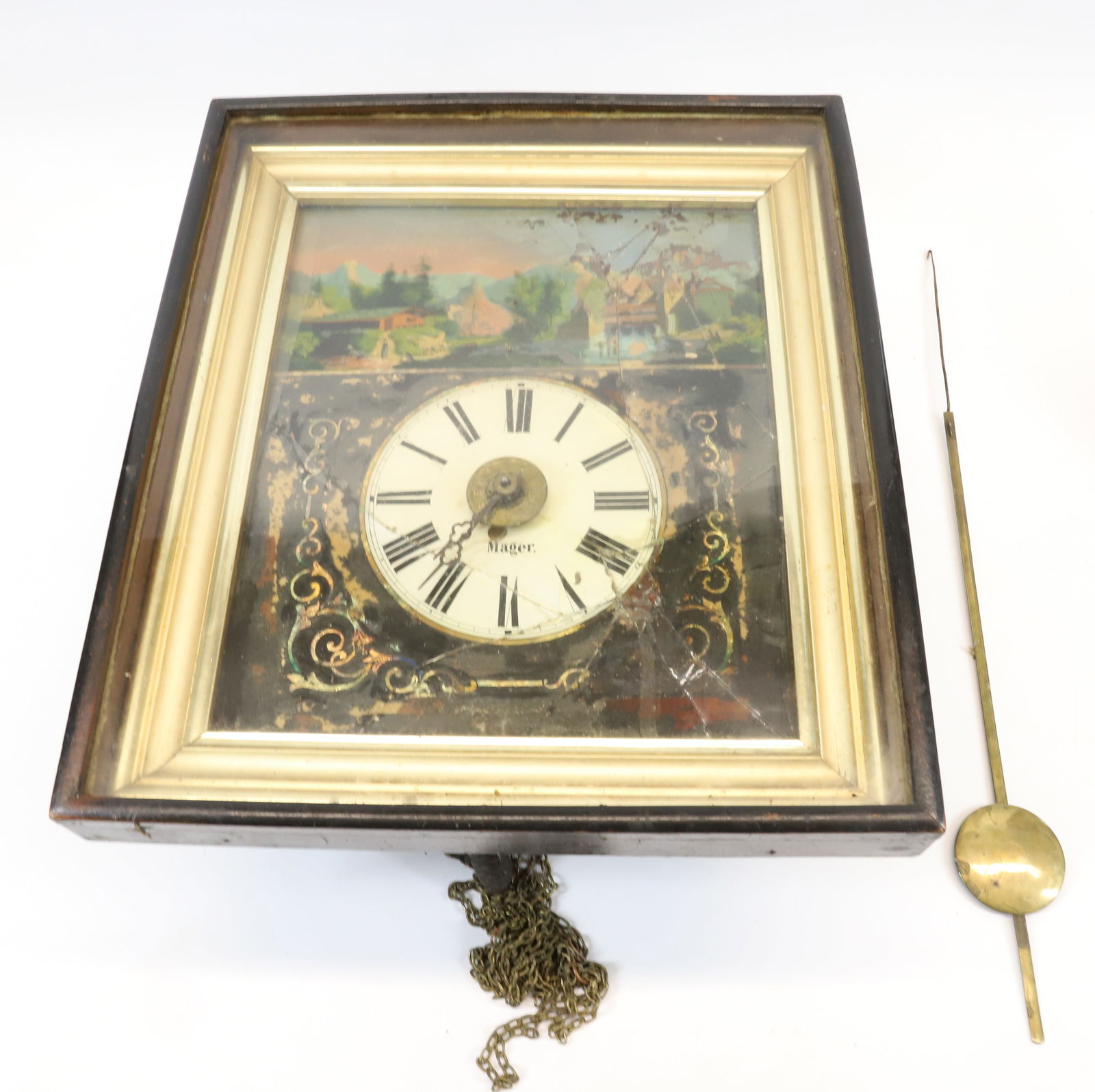 19TH C. MAGER WALL CLOCK: REVERSE PAINTED FACE, DIAL MRKD. "MAGER". 16" X 14". BRASS PENDULUM. ONE WEIGHT. AS-FOUND. PLEASE READ CAREFULLY - Terms for Purchasing and Shipping of Auction Items. Please read carefully before bidd