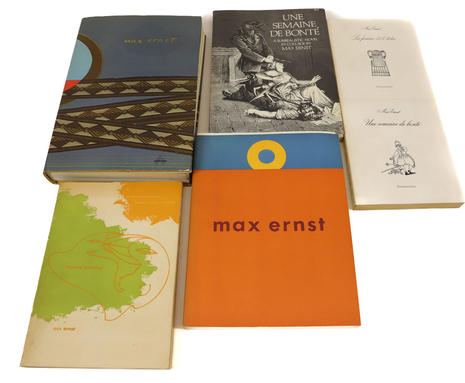 LOT OF MAX ERNST ART BOOKS: (6) INCLUDING: MAX ERNST, LIFE AND WORK BY RUSSELL, MAX ERNST A RETROSPECTIVE, GUGGENHEIM MUSEUM NY. UNA SEMAINE DE BONTE, SURREALISTIC NOVEL IN COLLAGE BY MAX ERNST, 1976 (SLIGHT SEPARATION OF BINDIN