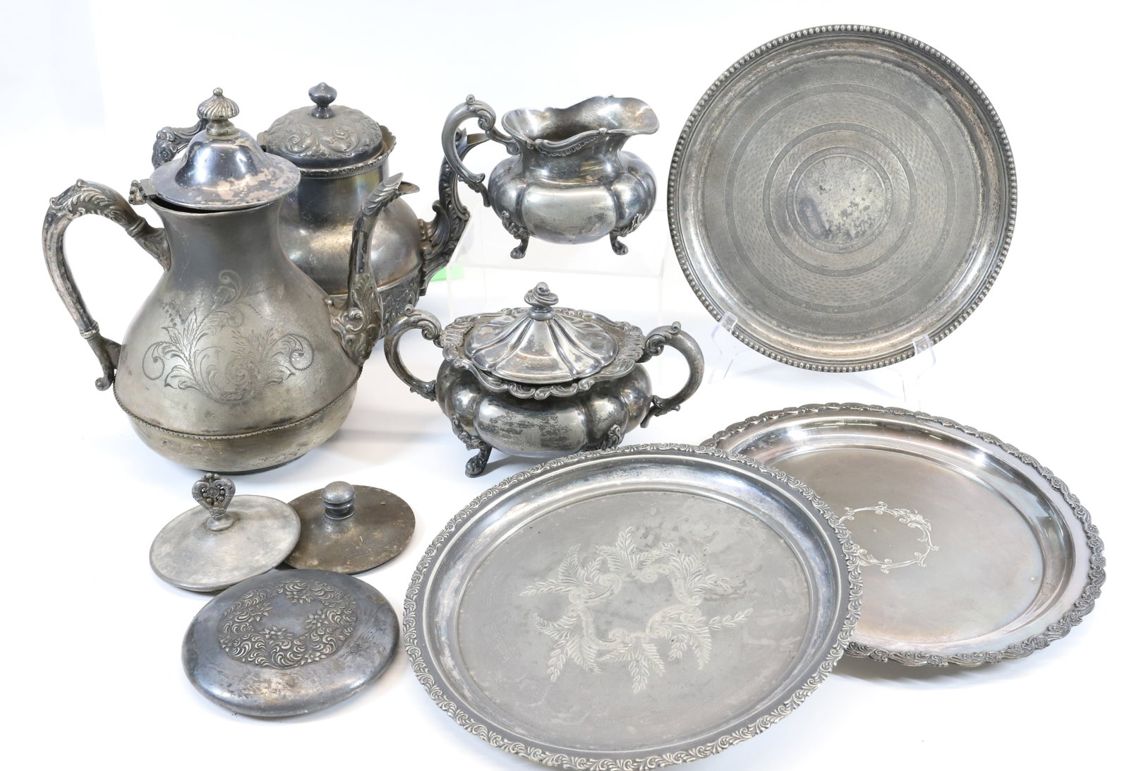 LOT OF VINTAGE QUADRUPLE PLATE: (7) INCLUDING: TEAPOTS, SUGAR, CREAMER, TRAYS AND MORE. PLEASE READ CAREFULLY - Terms for Purchasing and Shipping of Auction Items. Please read carefully before bidding. All payments for purchases wil