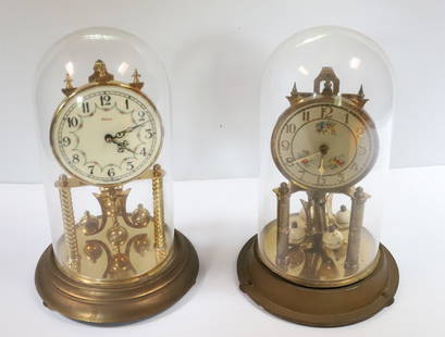 (2) DOMED GERMAN CLOCKS: PORCELAIN FACES. ONE MRKD. HECO. 11 1/2" H. PLEASE READ CAREFULLY – THIS IS AN ONLINE ONLY AND ONSITE AUCTION. THE ADDRESS WILL BE GIVEN AFTER THE AUCTION HAS ENDED AND TO ALL SUCCESSFUL