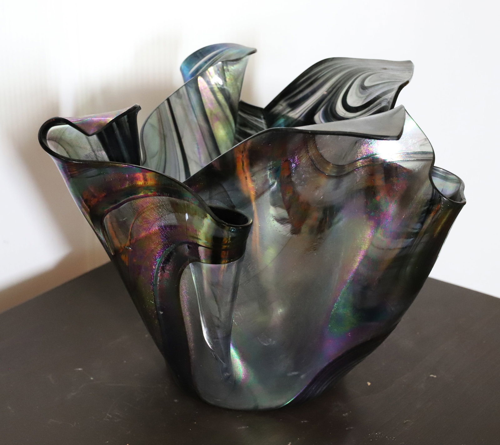 IRIDESCENT ART GLASS VASE: FOLDED HANDKERCHIEF STYLE. SIGNED ON BOTTOM. 8 1/2" X 11". PLEASE READ CAREFULLY – THIS IS AN ONLINE ONLY AND ONSITE AUCTION. THE ADDRESS WILL BE GIVEN AFTER THE AUCTION HAS ENDED AND TO ALL SUC