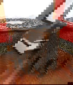 HEAVILY CARVED WOODEN TABLE