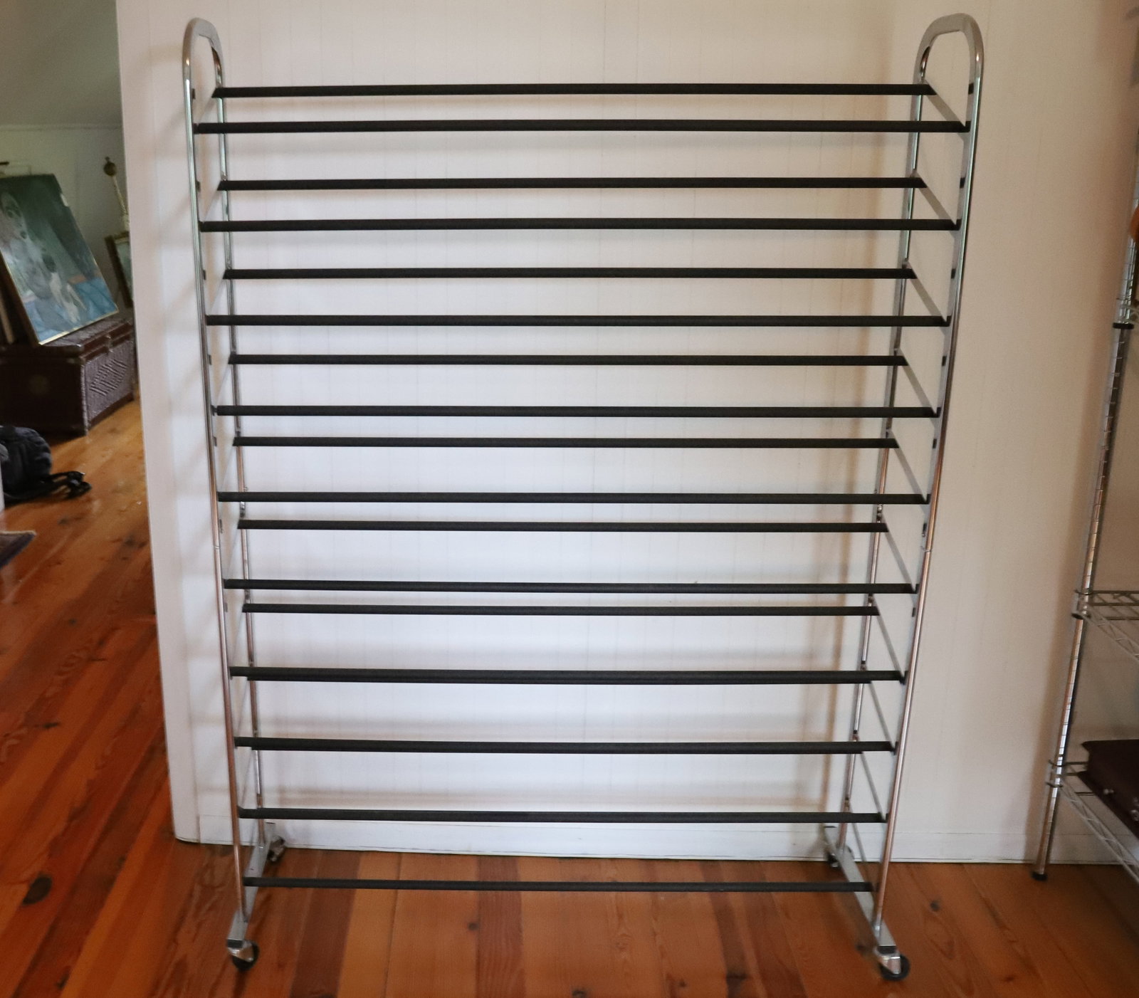 LARGE SHOE RACK: METAL ON WHEELS - 60" X 43" X 9 1/2" PLEASE READ CAREFULLY – THIS IS AN ONLINE ONLY AND ONSITE AUCTION. THE ADDRESS WILL BE GIVEN AFTER THE AUCTION HAS ENDED AND TO ALL SUCCESSFUL BIDDERS. THE H
