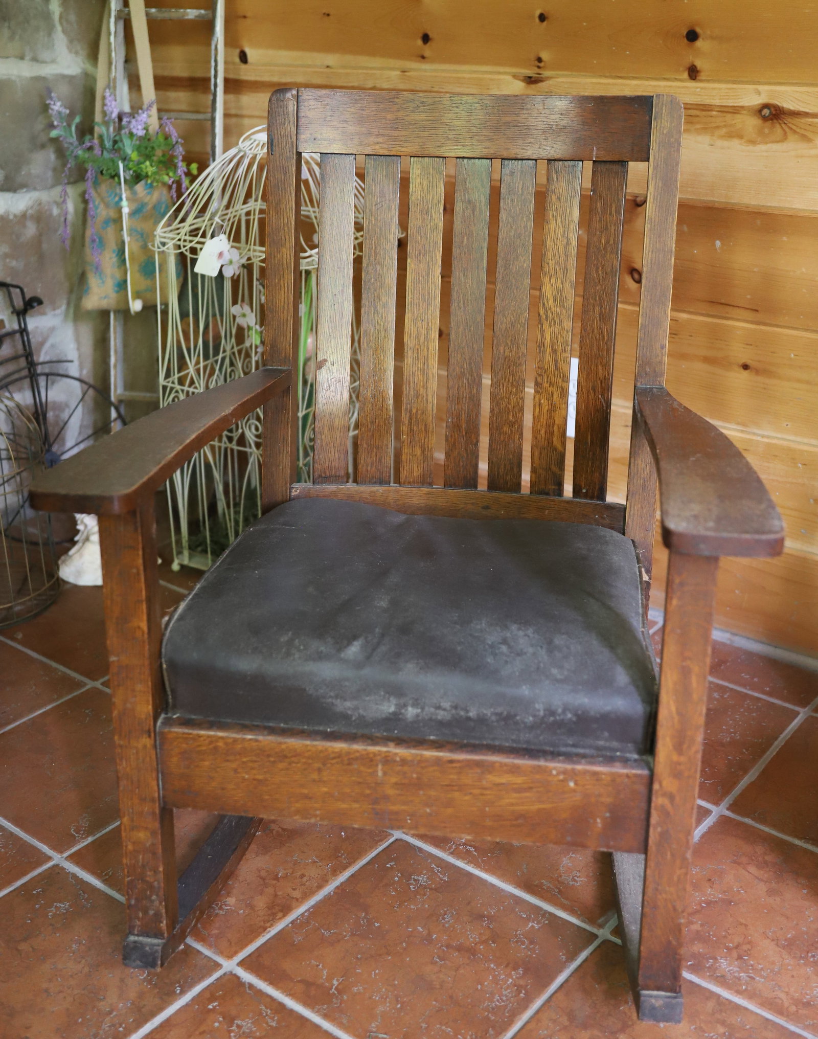 ARTS AND CRAFT ROCKING CHAIR: MRKD. AMERICAN CHAIR COMPANY. DROP-IN LEATHER SEAT. 35" X 27" X 22". PLEASE READ CAREFULLY – THIS IS AN ONLINE ONLY AND ONSITE AUCTION. THE ADDRESS WILL BE GIVEN AFTER THE AUCTION HAS ENDED AND 