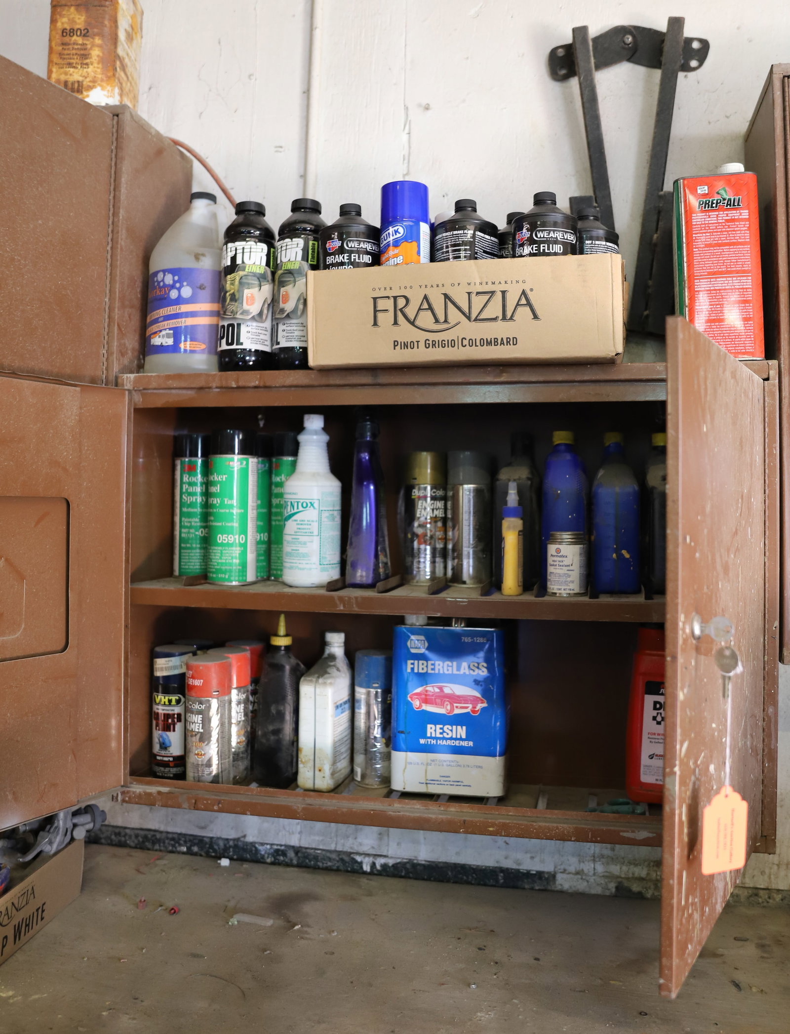 LAWSON CABINET WITH CONTENTS: ENGINE ENAMEL PAINT, OIL, DIESEL ADDITIVE, PREP-ALL, BRAKE FLUID AND MORE. LOCKS WITH KEY. Terms: PLEASE READ CAREFULLY - Terms for Purchasing and Shipping of Auction Items. Please read carefully befo