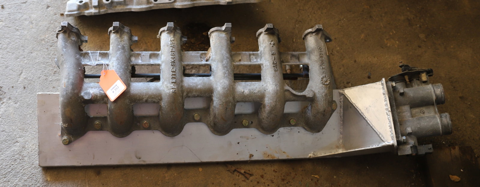 SIX-CYLINDER ALUMINUM INTAKE: UNUSUAL Terms: PLEASE READ CAREFULLY - Terms for Purchasing and Shipping of Auction Items. Please read carefully before bidding. All payments for purchases will be made through LiveAuctioneers.com pay