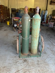 OXYGEN AND ACETYLENE TANKS WITH HOSES AND GAUGES