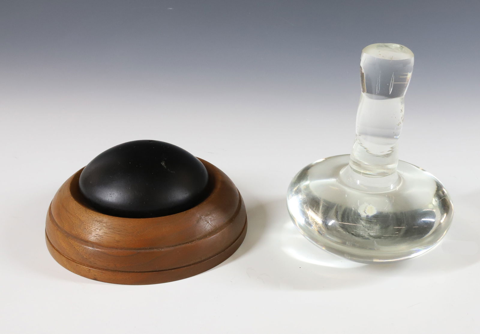 GLASS SMOOTHER AND SLICKING STONE: CLEAR GLASS SMOOTHER WITH BLACK SLICKING STONE AND WOODEN BASE. SMOOTHER 5 1/2" H. PLEASE READ CAREFULLY - Terms for Purchasing and Shipping of Auction Items. Please read carefully before bidding. All