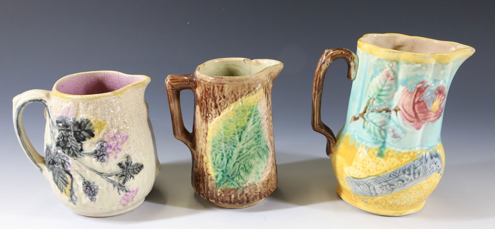 (3) MAJOLICA PITCHERS (1 of 8)