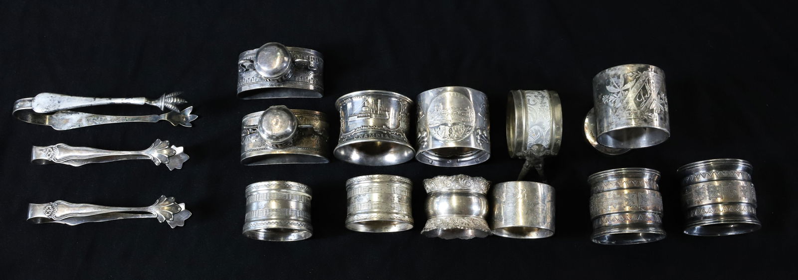 LOT OF SILVERPLATE NAPKIN RINGS AND TONGS (1 of 5)