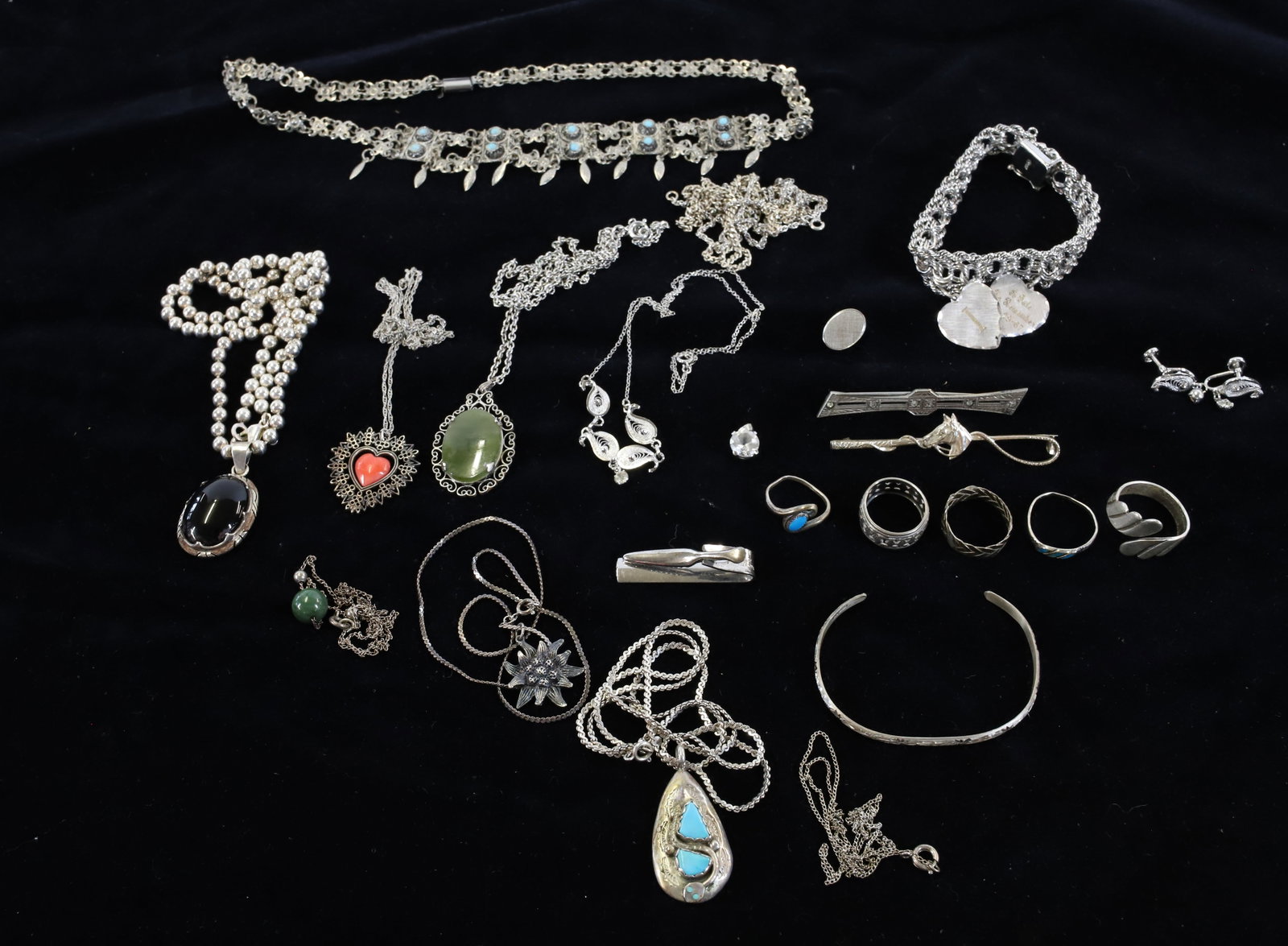 LOT OF STERLING SILVER JEWELRY: INCLUDING: RINGS, NECKLACES, BRACELETS AND MORE. PENDANT WITH TURQUOISE MRKD. "EFFIE C., ZUNI". MAJORITY OF ITEMS ARE MRKD. STERLING OR .925...SOME DO NOT HAVE MARKINGS, WE CANNOT GUARANTEE THEY ARE S