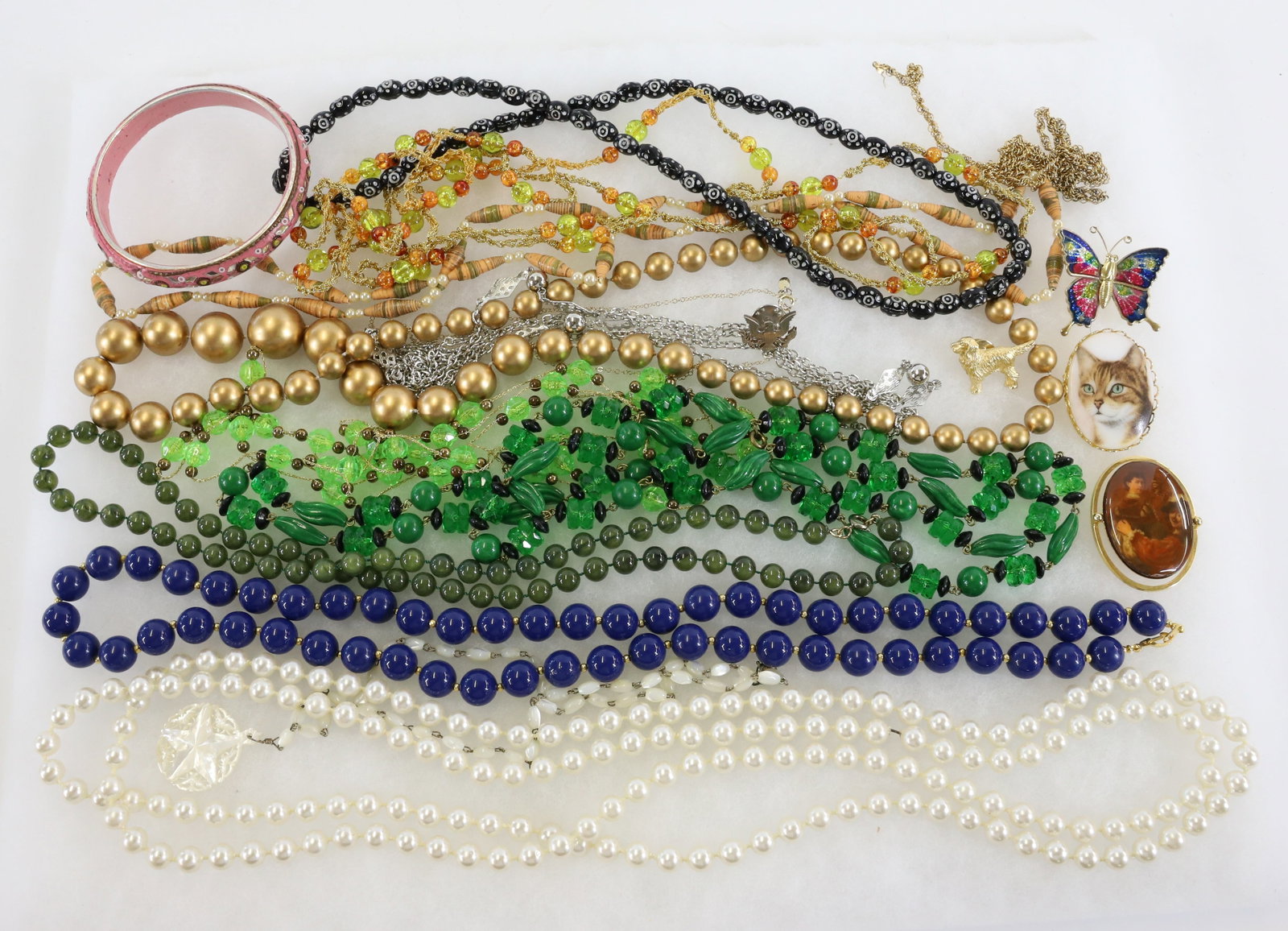 LOT OF COSTUME JEWELRY: INCLUDING: NECKLACES, PINS, BRACELETS AND MORE. TERMS: PLEASE READ CAREFULLY - Terms for Purchasing and Shipping of Auction Items. Please read carefully before bidding. All payments for purchases will
