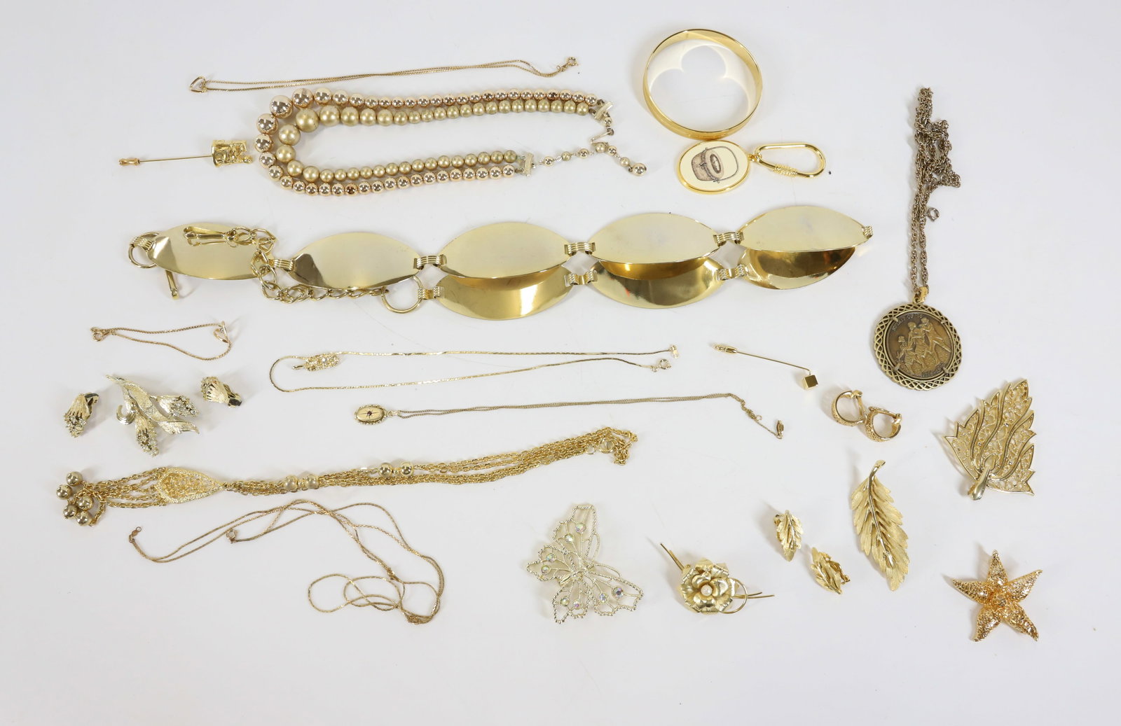 LOT OF COSTUME JEWELRY: INCLUDING: NECKLACES, BRACELETS, PINS, BELT AND MORE. TERMS: PLEASE READ CAREFULLY - Terms for Purchasing and Shipping of Auction Items. Please read carefully before bidding. All payments for purchase