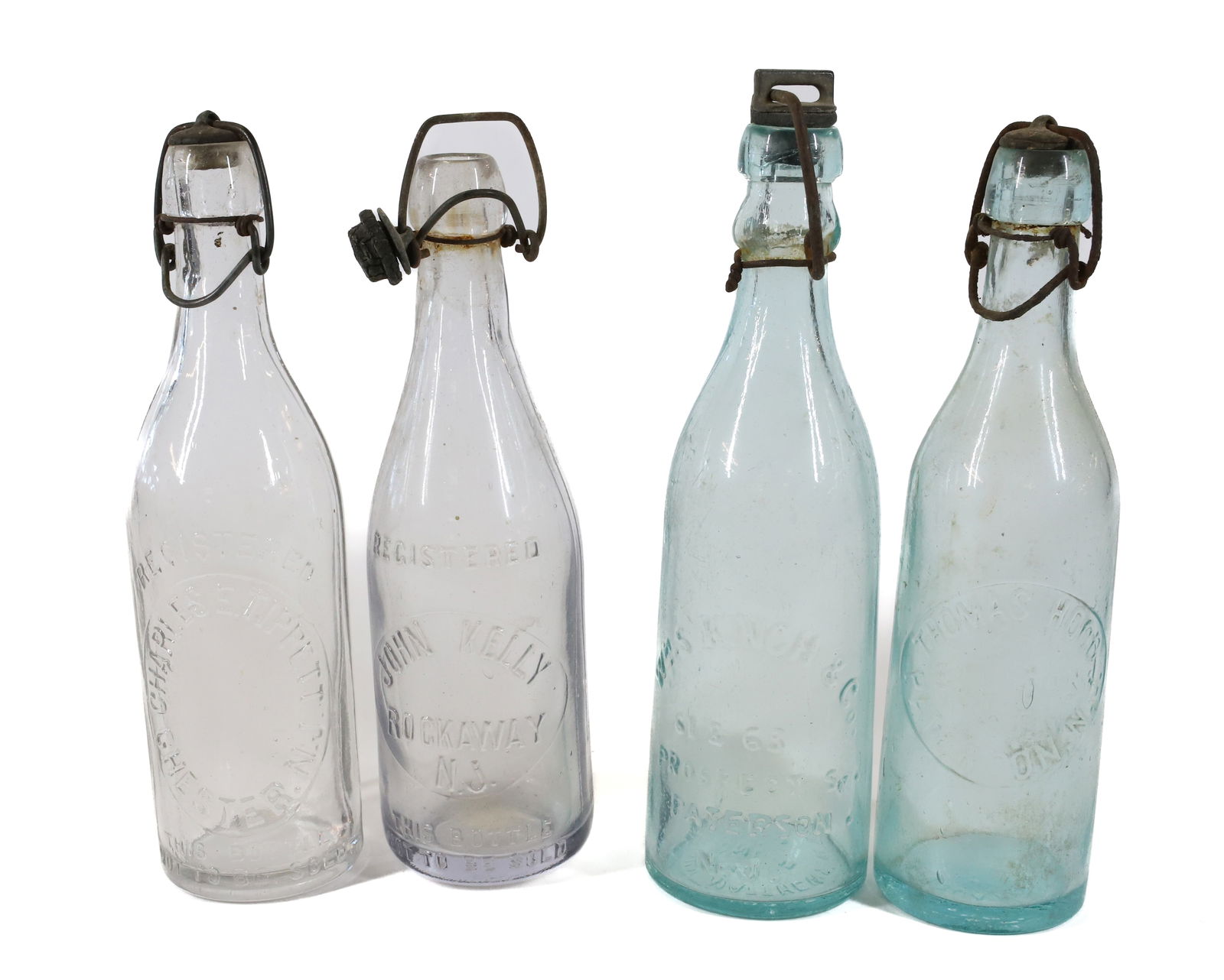 (4) PATERSON, NJ BOTTLES W/STOPPERS (1 of 6)
