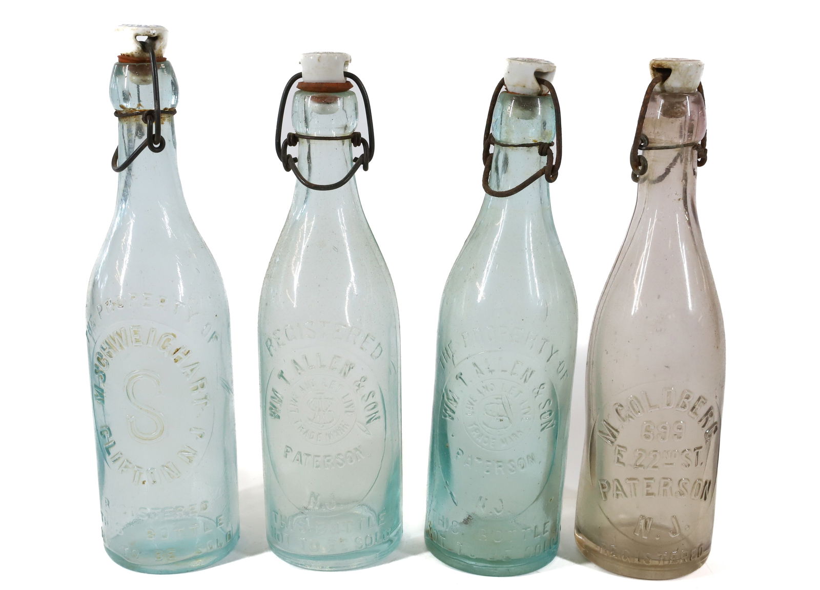 (4) PATERSON, NJ BOTTLES W/STOPPERS (1 of 4)