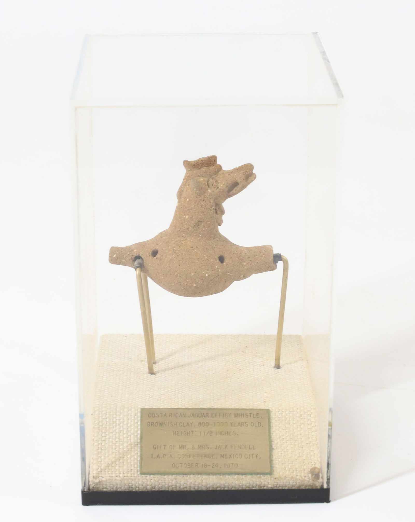 COSTA RICAN EFFIGY WHISTLE: BROWNISH CLAY JAGUAR WHISTLE. 800-1000 YEARS OLD. 1 1/2" H. IN LUCITE DISPLAY CASE WITH PLAQUE. TERMS: PLEASE READ CAREFULLY - Terms for Purchasing and Shipping of Auction Items. Please read carefully