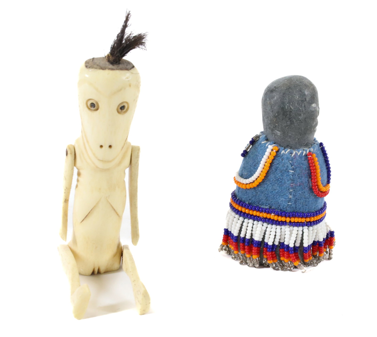 CARVED BONE FIGURE OF A WOMAN: ESKIMO/INUIT CARVED BONE WITH MOVEABLE ARMS/LEGS. CA. EARLY 20TH C. 5 1/2" L. WITH CARVED BEADED FIGURE. 3 1/4" H. TERMS: PLEASE READ CAREFULLY - Terms for Purchasing and Shipping of Auction Items. Pl