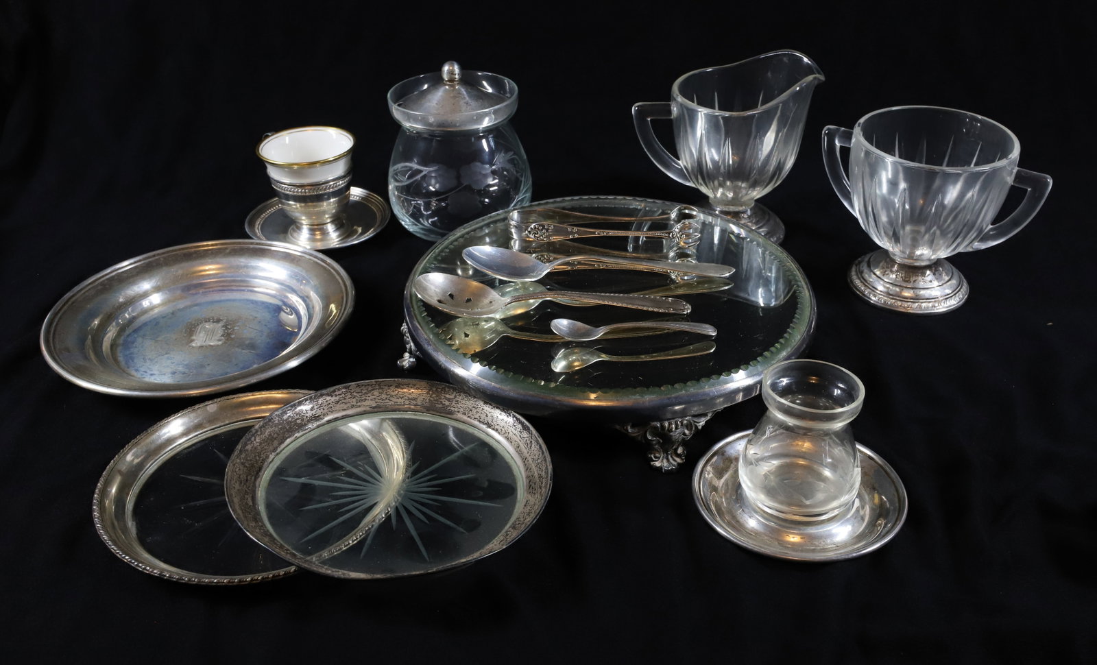 (13) STERLING SILVER LOT: INCLUDES SUGAR,CREAMER, JAM POT, TWO UNDER PLATE, STERLING SMALL PLATE, CUP & SAUCER, STERLING TONGS, THREE SPOONS AND PLATED TONGS,SMALL MIRROR PLATEAU 5"H, PLATEAU 8"DIA PLEASE READ CAREFULLY –