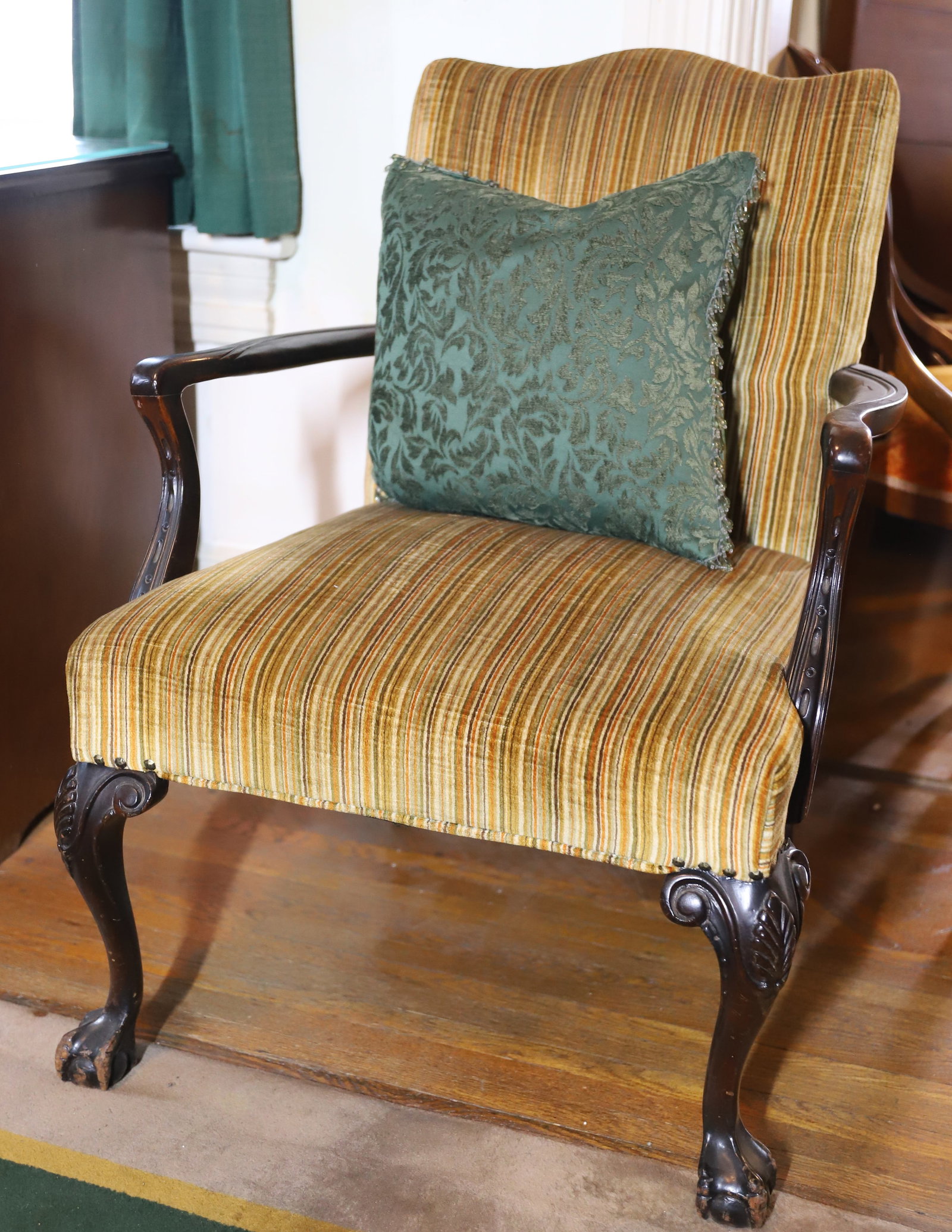 ARM CHAIR: CHIPPENDALE BALL & CLAW FEET WOODEN ARMS, UPHOLSTERY WITH BEADED PILLOW 37" X 25" X 24" PLEASE READ CAREFULLY – THIS IS AN ONSITE ONLINE ONLY AUCTION. The Address is 206 Market St. Bangor, Pa. 18013
