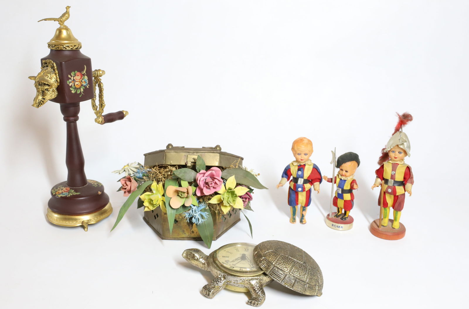 DECORATIVE SMALLS: (6) ITALY MUSIC BOX NOVELTY GRINDER, BENTLEY CLOCK TURTLE, THREE FIGURINE WOOD CLOTH ITALY METAL FLOWER ARRANGEMENT 8"H PLEASE READ CAREFULLY – THIS IS AN ONSITE ONLINE ONLY AUCTION. The Address