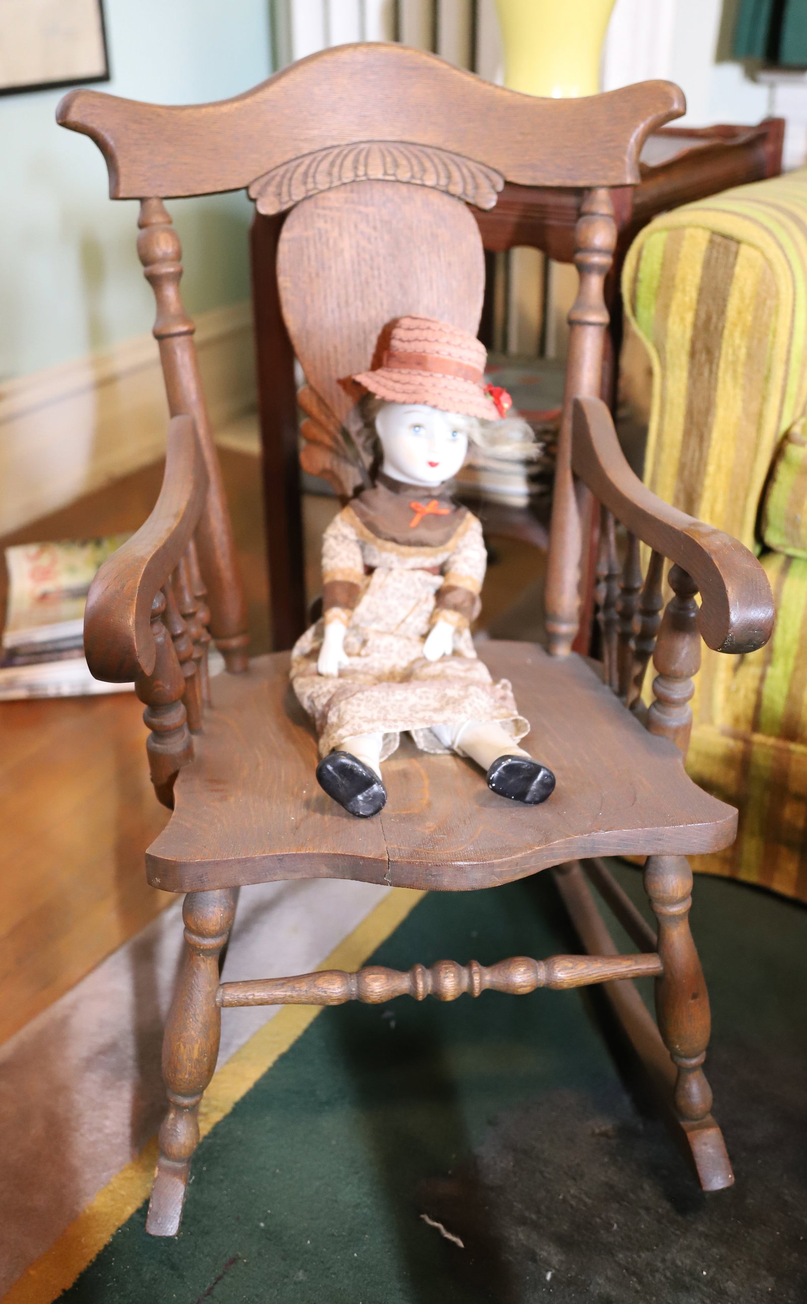 CHILDS OAK ROCKER AND DOLL: SOLID OAK WITH ARMS, PORCELAIN HEAD DOLL 29" X 16", 16" PLEASE READ CAREFULLY – THIS IS AN ONSITE ONLINE ONLY AUCTION. The Address is 206 Market St. Bangor, Pa. 18013