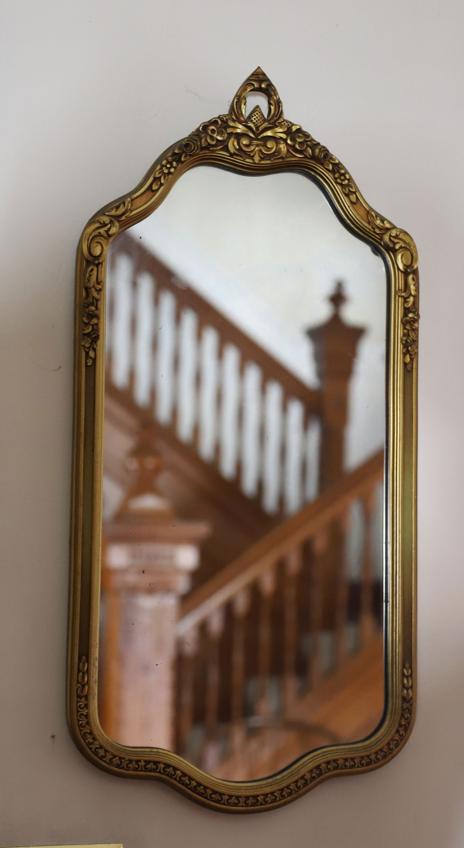 ART DECO WALL MIRROR: GOLD AND GESSO FRAME WITH DECO MOTIF 28" X 13 1/2" PLEASE READ CAREFULLY – THIS IS AN ONSITE ONLINE ONLY AUCTION. The Address is 206 Market St. Bangor, Pa. 18013