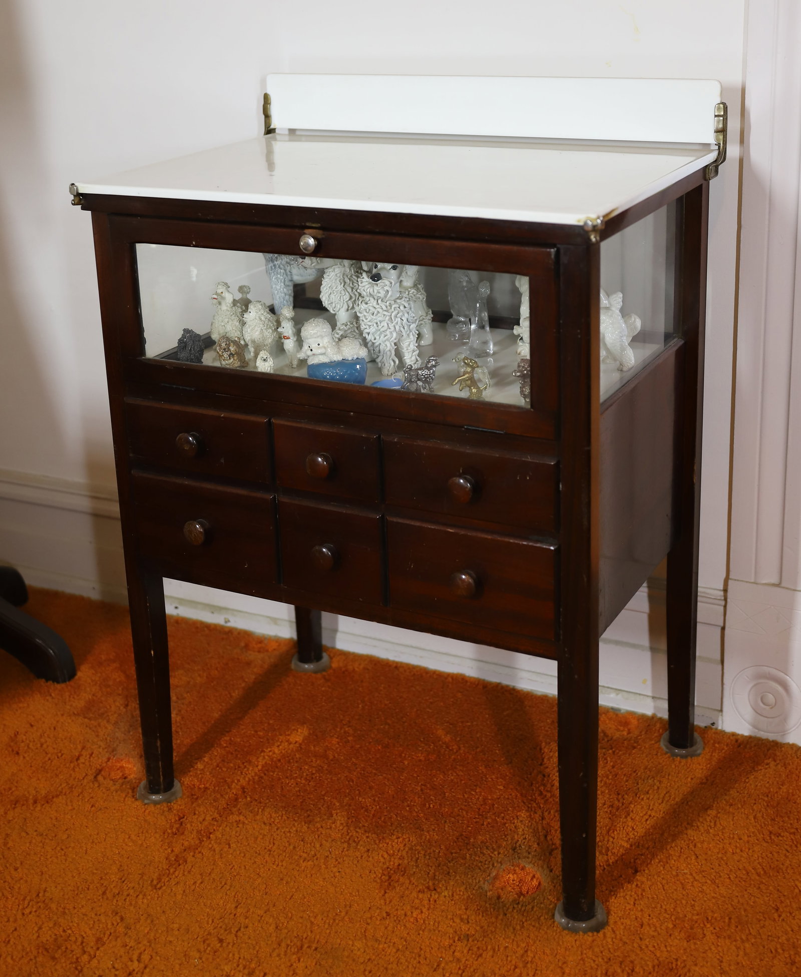W.D.ALLISON CO LOW CABINET: MILK GLASS TOP WITH SPLASH BOARD, WINDOWED COMPARTMENT WITH MILK GLASS BASE WITH SIX DRAWERS 36"H X 25 1/2" X 17 1/2" VERY GOOD CONDITION NICE FINISH PLEASE READ CAREFULLY – THIS IS AN ONSITE ON