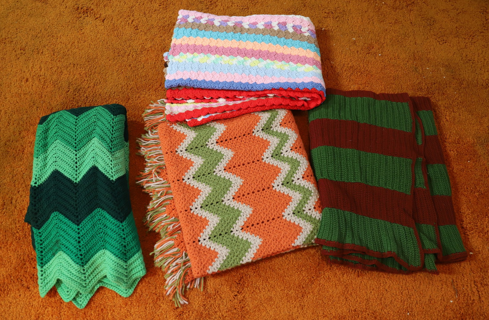 (5) VINTAGE AFGHAN BLANKETS: DIFFERENT COLORS ALL HAND MADE DIFFERENT SIZES PLEASE READ CAREFULLY – THIS IS AN ONSITE ONLINE ONLY AUCTION. The Address is 206 Market St. Bangor, Pa. 18013