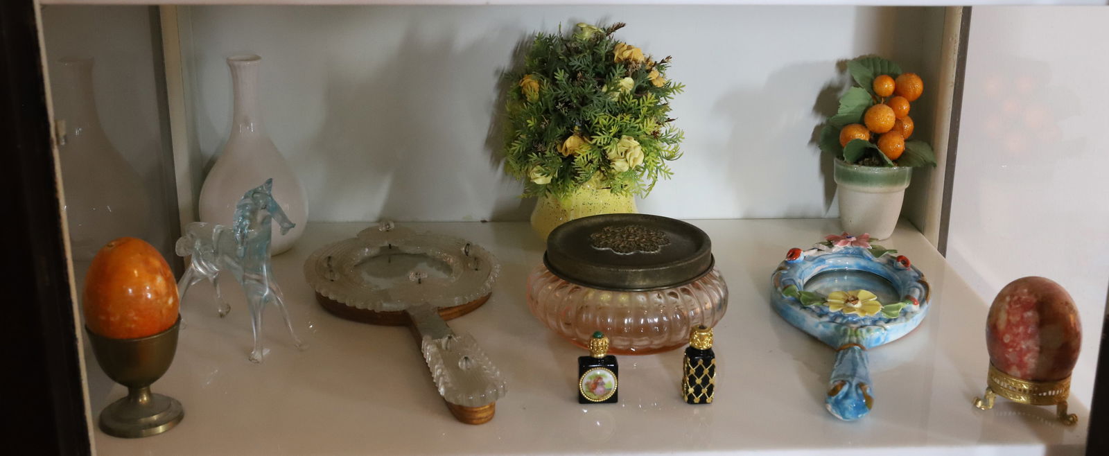 SHELF OF ITEMS: INCLUDING TWO HAND MIRRORS, TWO COBALT PERFUME BOTTLES, STONE EGGS, HORSE, FLOWERS IN POT PLEASE READ CAREFULLY – THIS IS AN ONSITE ONLINE ONLY AUCTION. The Address is 206 Market St. Bangor, Pa.