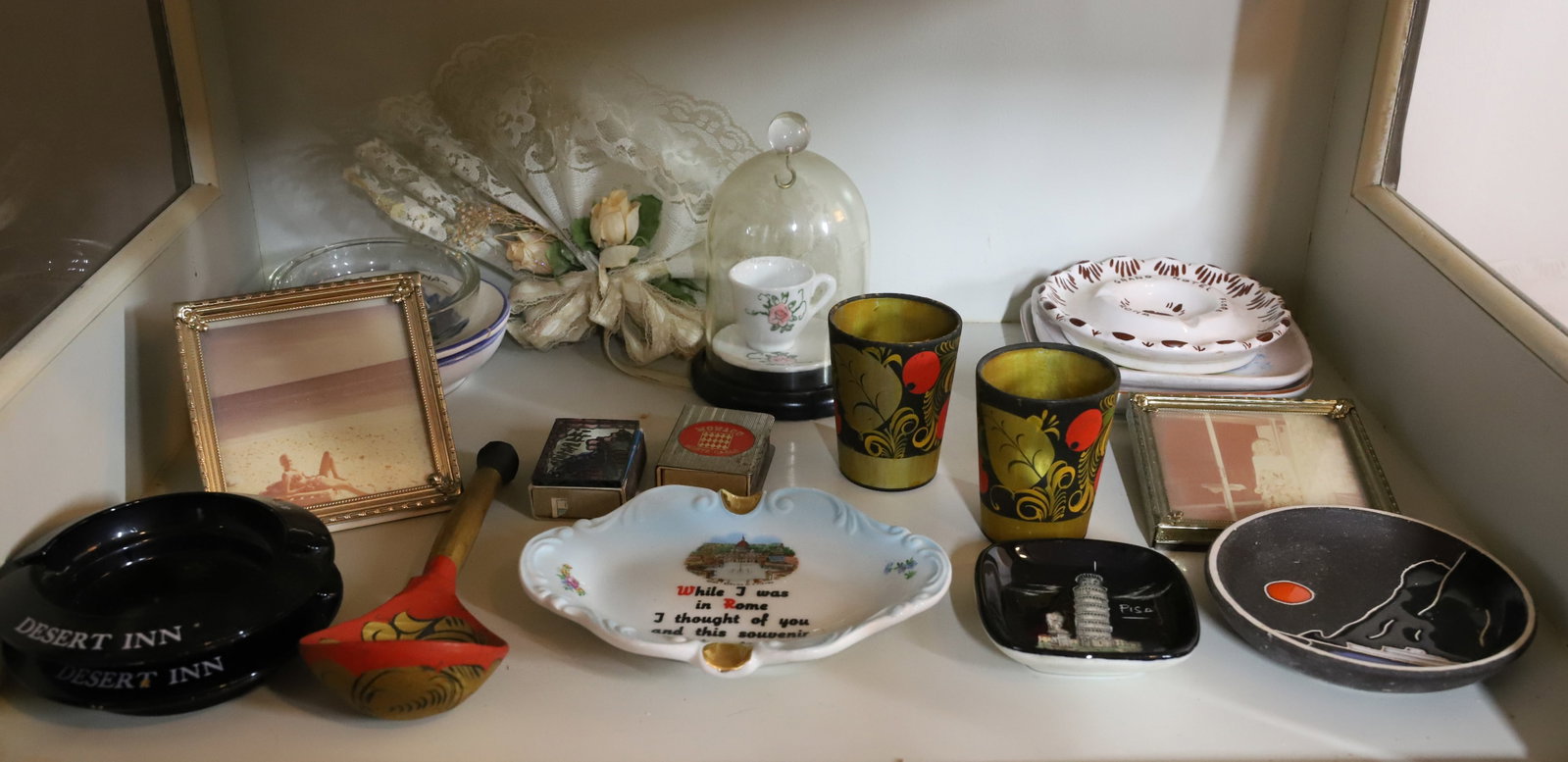 SHELF OF ITEMS: ASHTRAYS, RUSSIAN SOUVENIRS, SMALL SOUVENIR PLATES ETC 3" TO 6" PLEASE READ CAREFULLY – THIS IS AN ONSITE ONLINE ONLY AUCTION. The Address is 206 Market St. Bangor, Pa. 18013