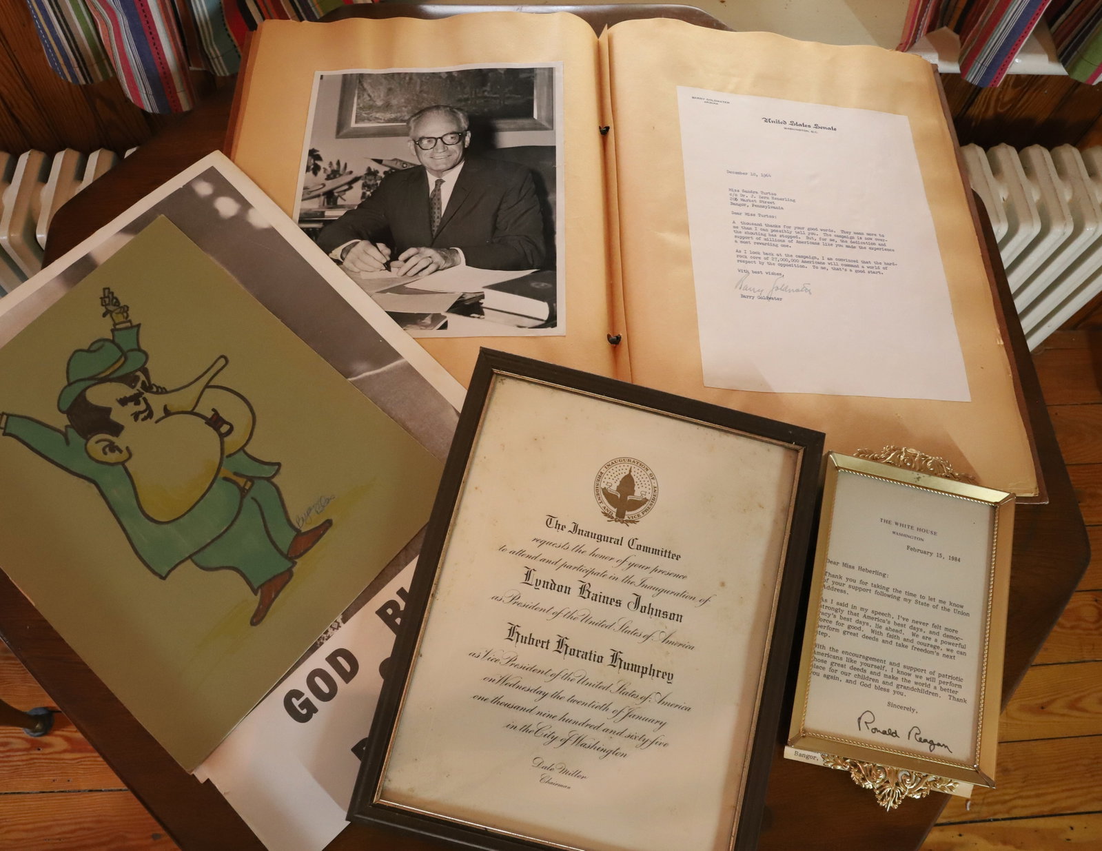 POLITICAL AUTOGRAPHS/INVITATION: SIGNATURE OF BARRY GOLDWATER, RONALD REAGAN, AND INVITATION TO INAUGURATION OF LYNDON JOHNSON ALONG WITH SCRAP BOOK 17" X 12" PLEASE READ CAREFULLY – THIS IS AN ONSITE ONLINE ONLY AUCTION. The A