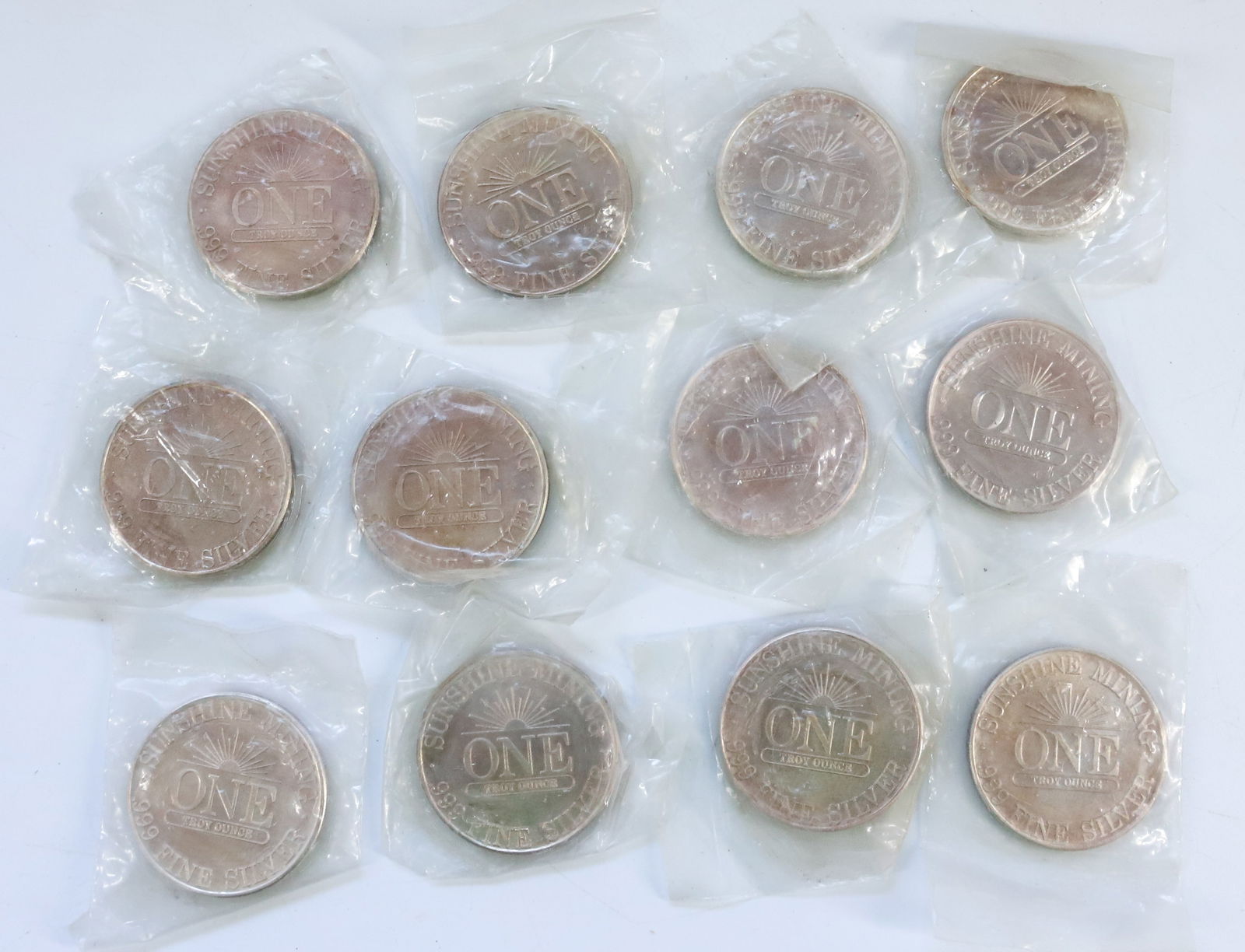 (12) SUNSHINE MINING 1 OZ .999 FINE COINS (1 of 5)